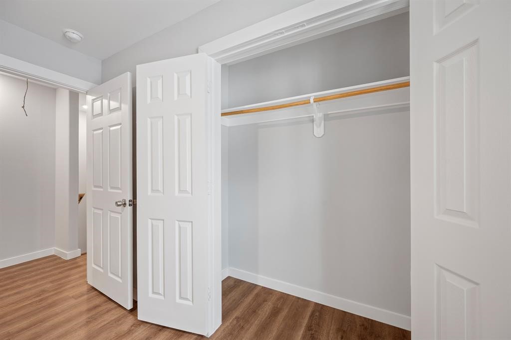 7804 Crestview Drive, Unit B Houston, TX 77028 - Photo 15 of 23 a view of walk in closet with wooden floor