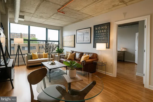 a living room with furniture and a large window
