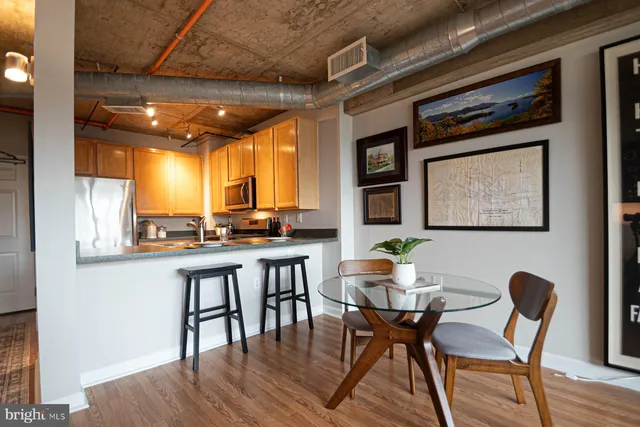 a dining room with furniture and window
