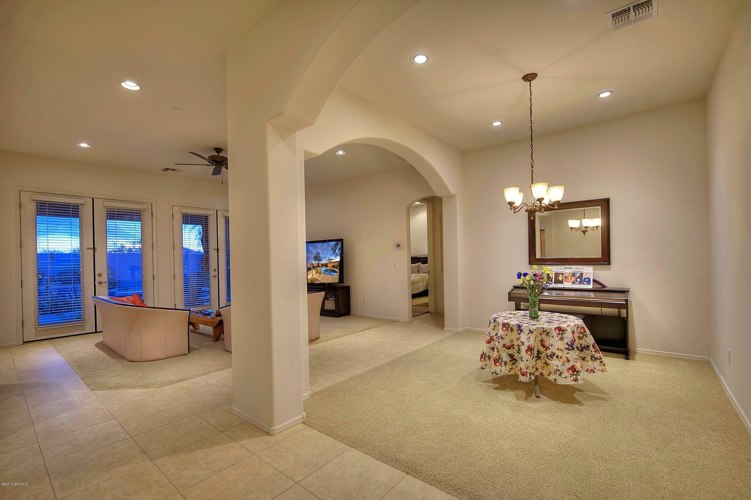 2323 West Apache Rain Road Phoenix, AZ 85085 - Photo 11 of 29 003_Dining-Living Room View