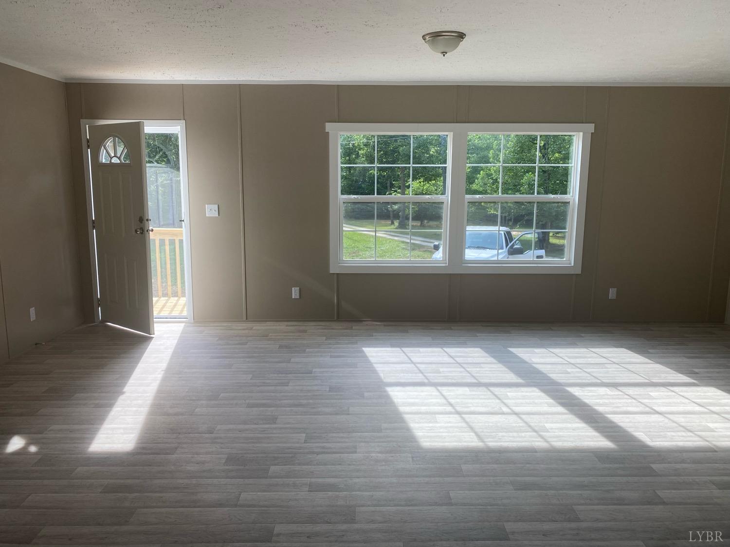 4006 Red House Road Appomattox, VA 24522 - Photo 2 of 11 a view of empty room with windows
