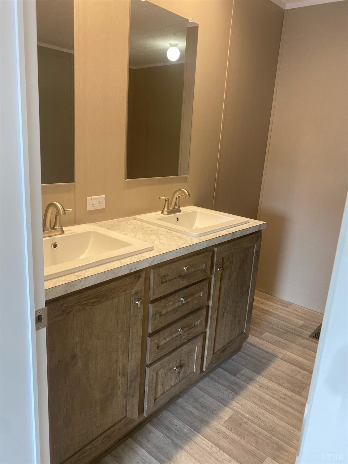 4006 Red House Road Appomattox, VA 24522 - Photo 4 of 11 a bathroom with a sink and a mirror