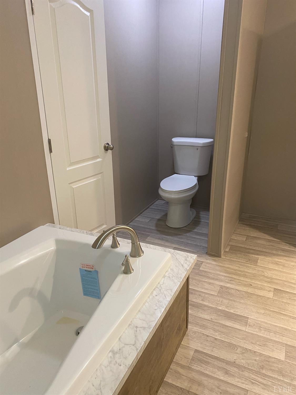 4006 Red House Road Appomattox, VA 24522 - Photo 6 of 11 a bathroom with a sink and a toilet