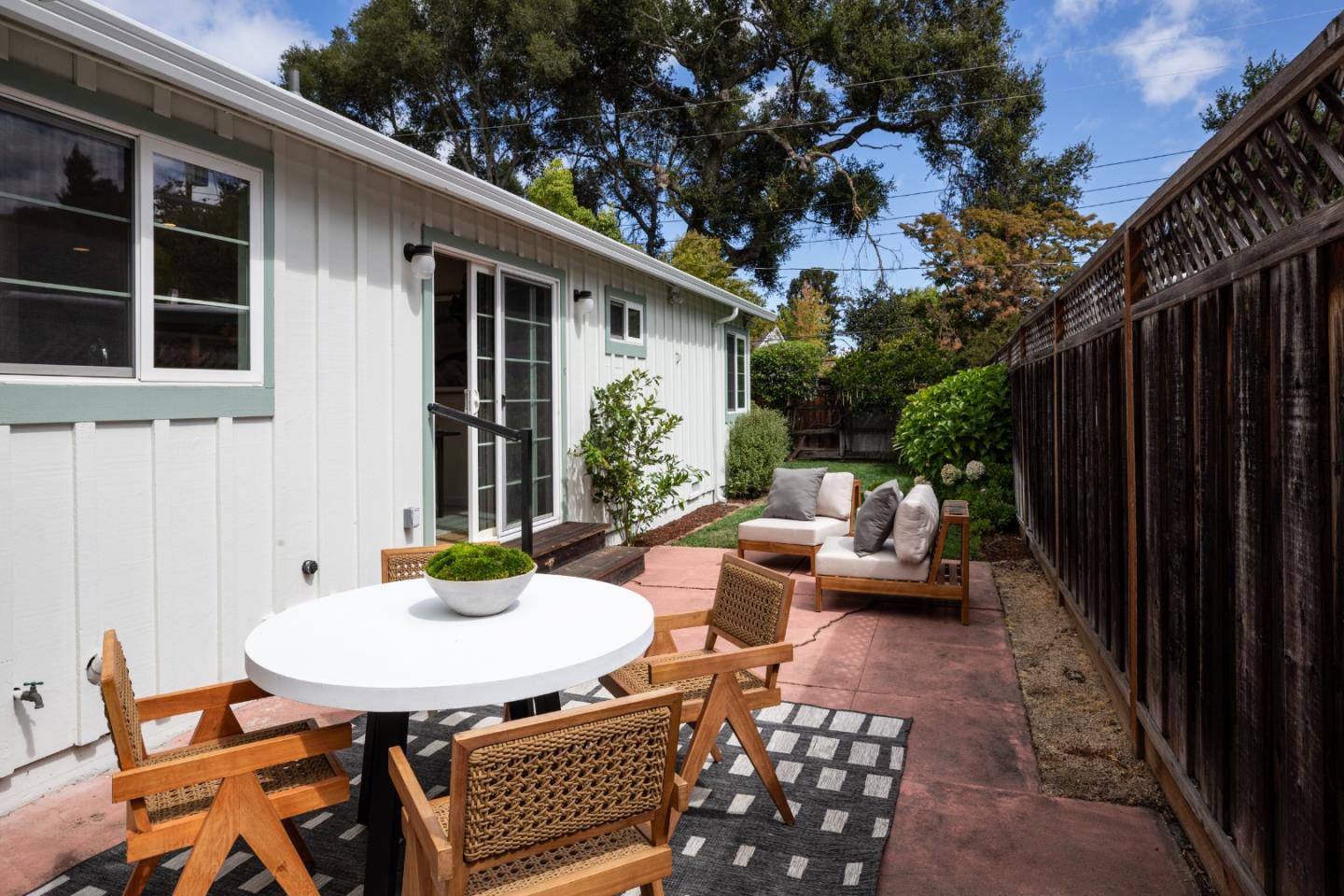 317 Bay Road Menlo Park, CA 94025 - Photo 21 of 26 a view of a patio with a table and chairs and potted plants