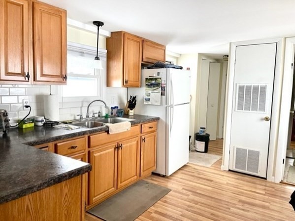 1 B Kittredge Road Shirley, MA 01464 - Photo 6 of 16 a kitchen with stainless steel appliances a refrigerator sink and cabinets