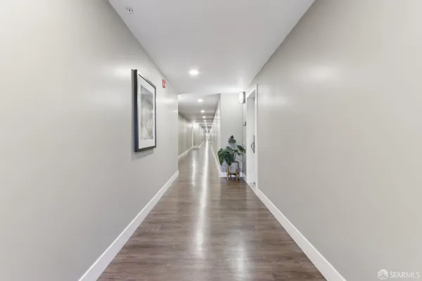 a hallway with wooden floor