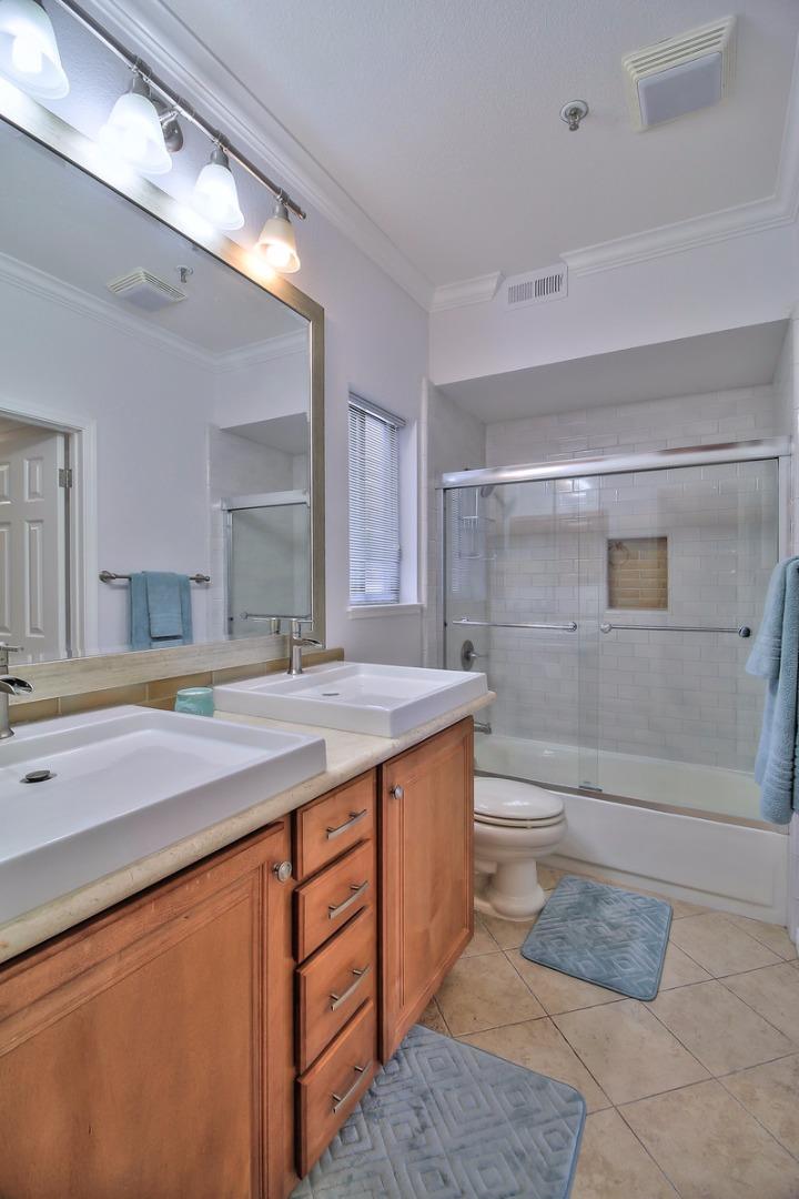 2200 Agnew Road, Unit 210 Santa Clara, CA 95054 - Photo 11 of 30 a bathroom with a granite countertop sink a toilet and bathtub