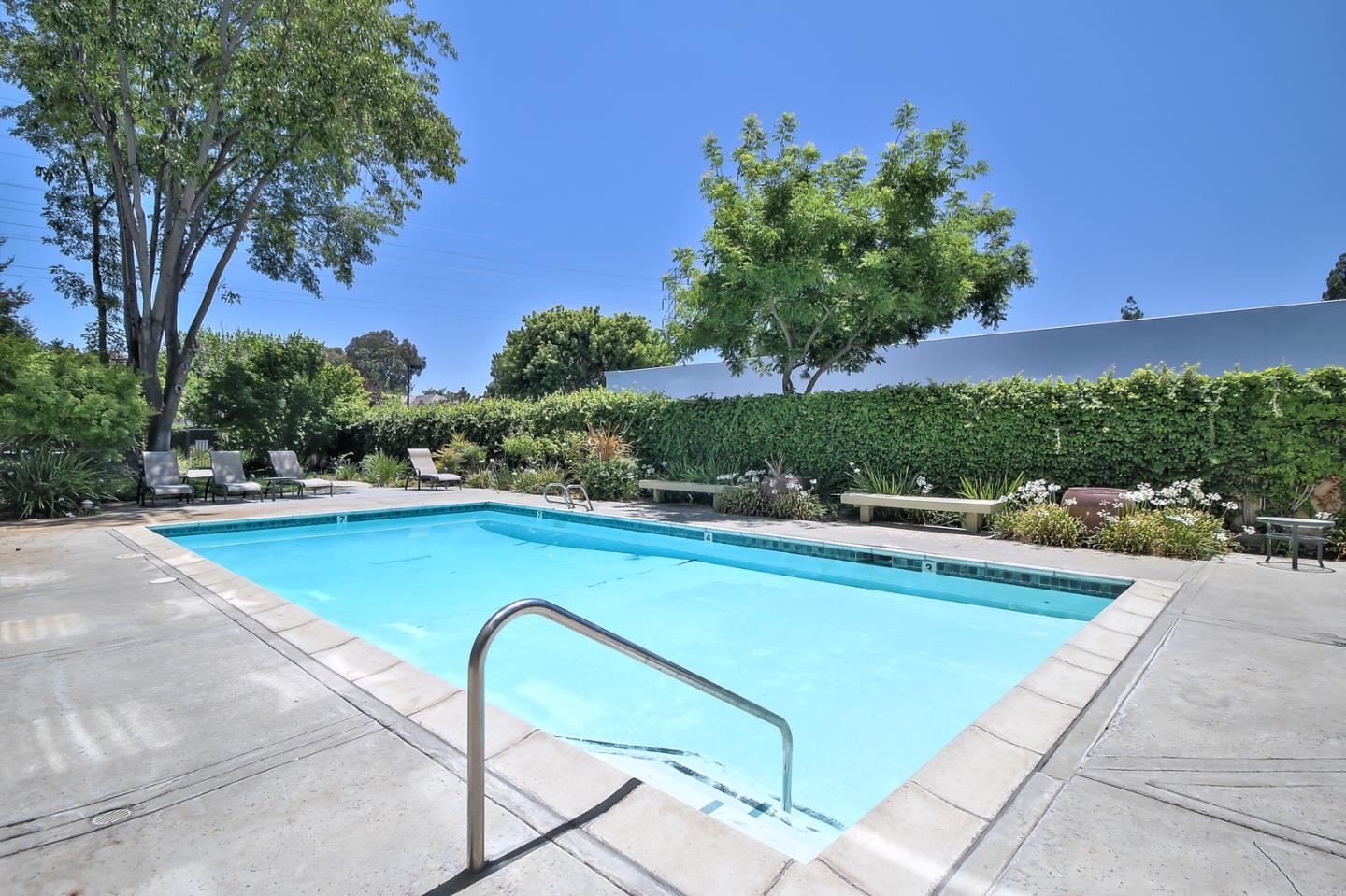 2200 Agnew Road, Unit 210 Santa Clara, CA 95054 - Photo 16 of 30 a view of a swimming pool with lounge chair