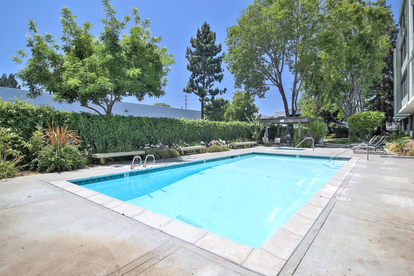 2200 Agnew Road, Unit 210 Santa Clara, CA 95054 - Photo 17 of 30 an outdoor space with swimming pool and trees