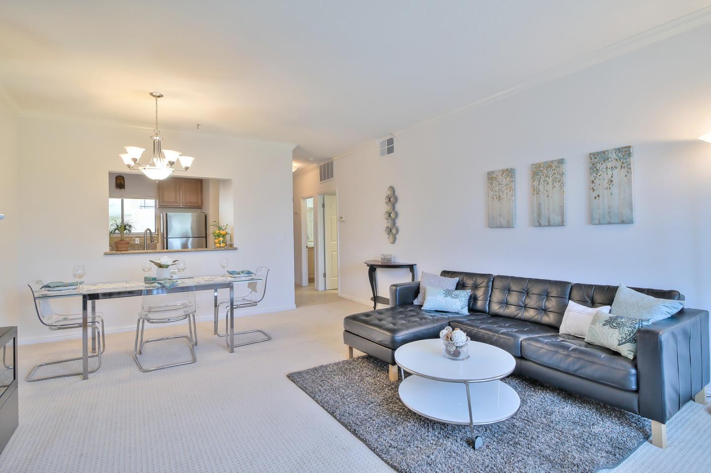 2200 Agnew Road, Unit 210 Santa Clara, CA 95054 - Photo 2 of 30 a living room with furniture and a chandelier