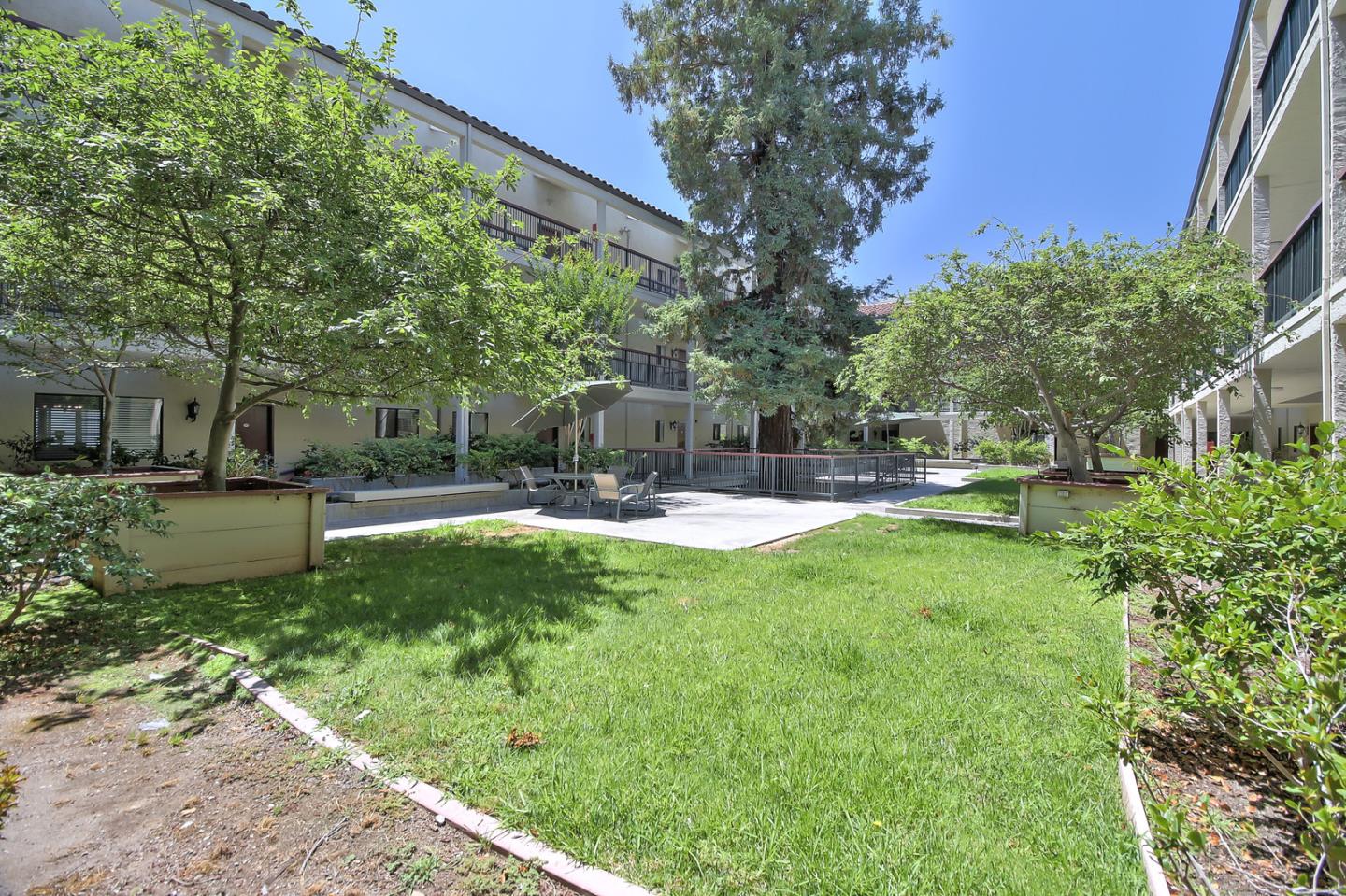 2200 Agnew Road, Unit 210 Santa Clara, CA 95054 - Photo 25 of 30 a view of a garden with a fountain