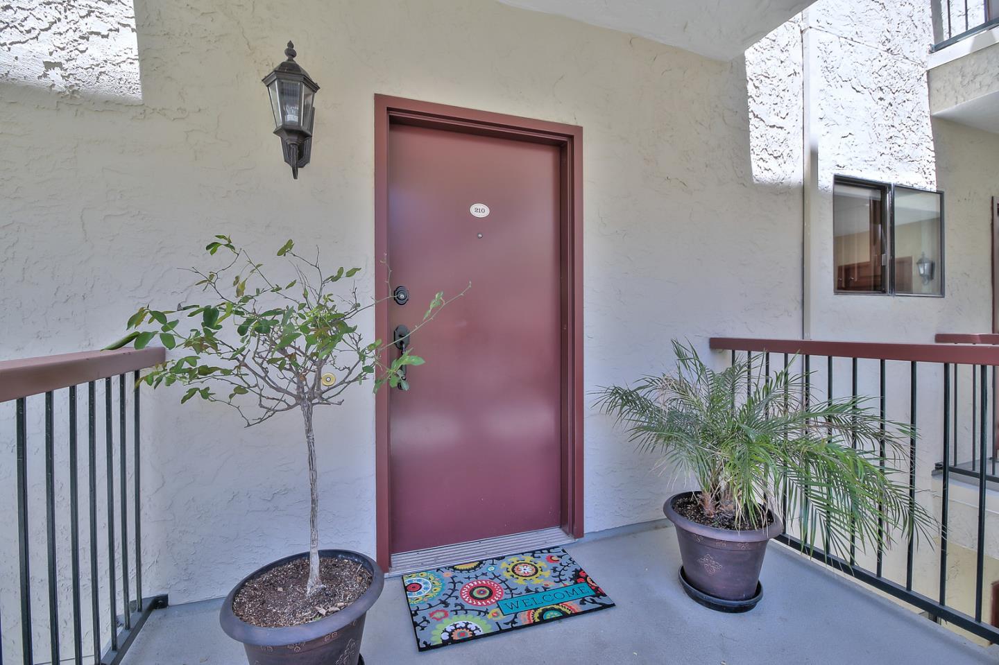 2200 Agnew Road, Unit 210 Santa Clara, CA 95054 - Photo 28 of 30 a view of a entryway with flower pots