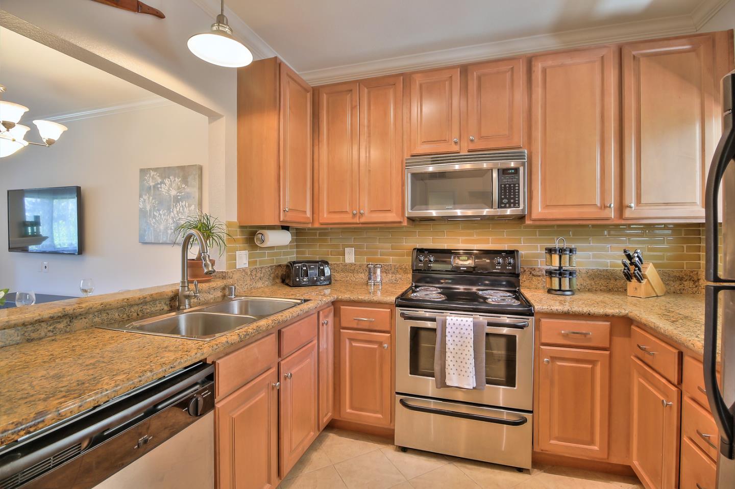 2200 Agnew Road, Unit 210 Santa Clara, CA 95054 - Photo 6 of 30 a kitchen with stainless steel appliances granite countertop a sink stove and cabinets