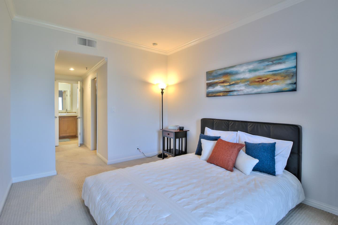 2200 Agnew Road, Unit 210 Santa Clara, CA 95054 - Photo 9 of 30 a bedroom with a bed and a painting on the wall
