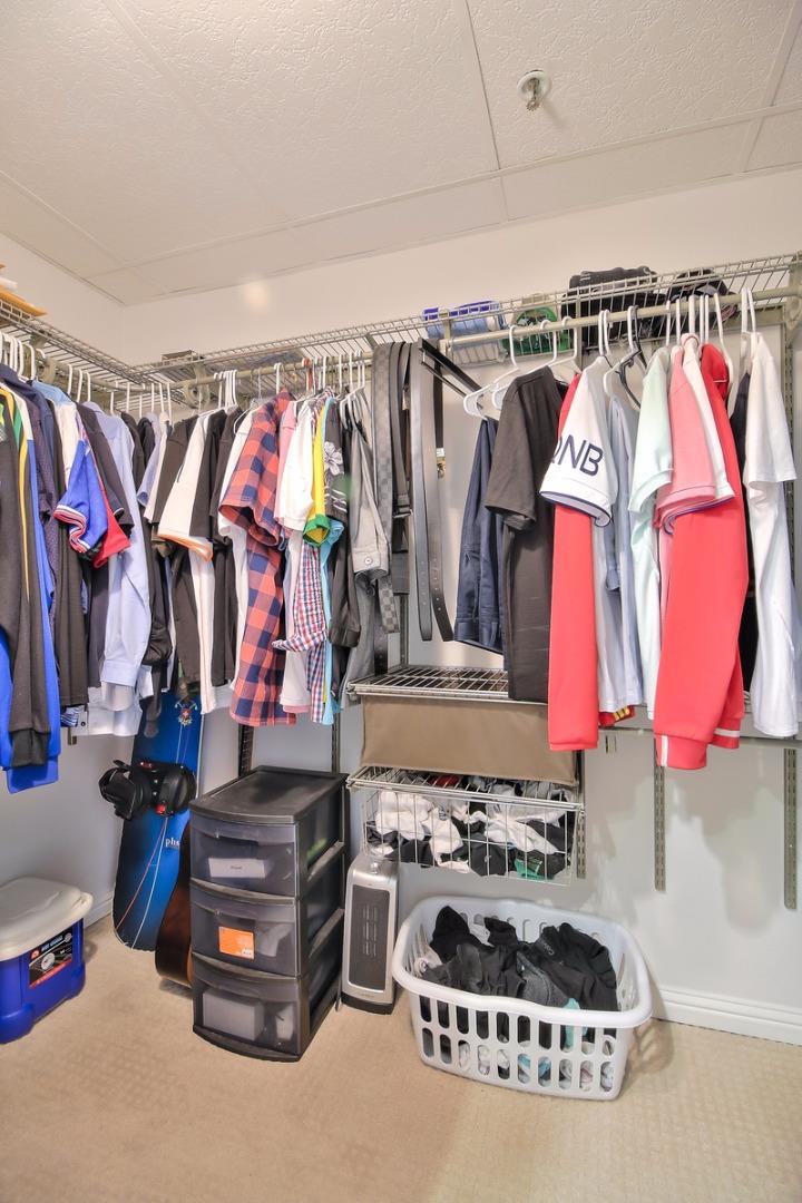 2200 Agnew Road, Unit 210 Santa Clara, CA 95054 - Photo 10 of 30 a view of walk in closet with clothes and shoes