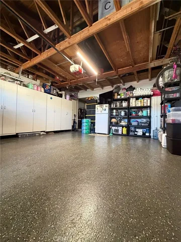 a view of empty room with wooden ceiling