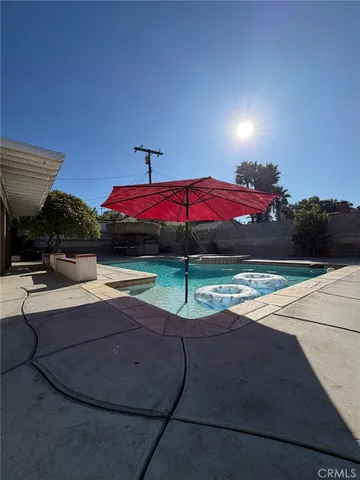 a view of swimming pool with seating space