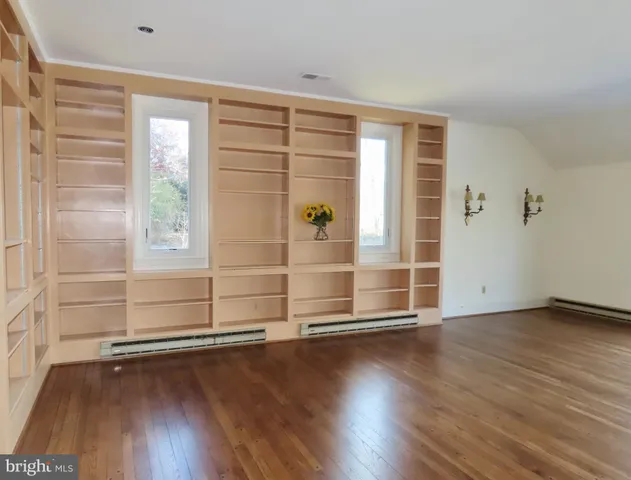 a view of a house with a tree front of house