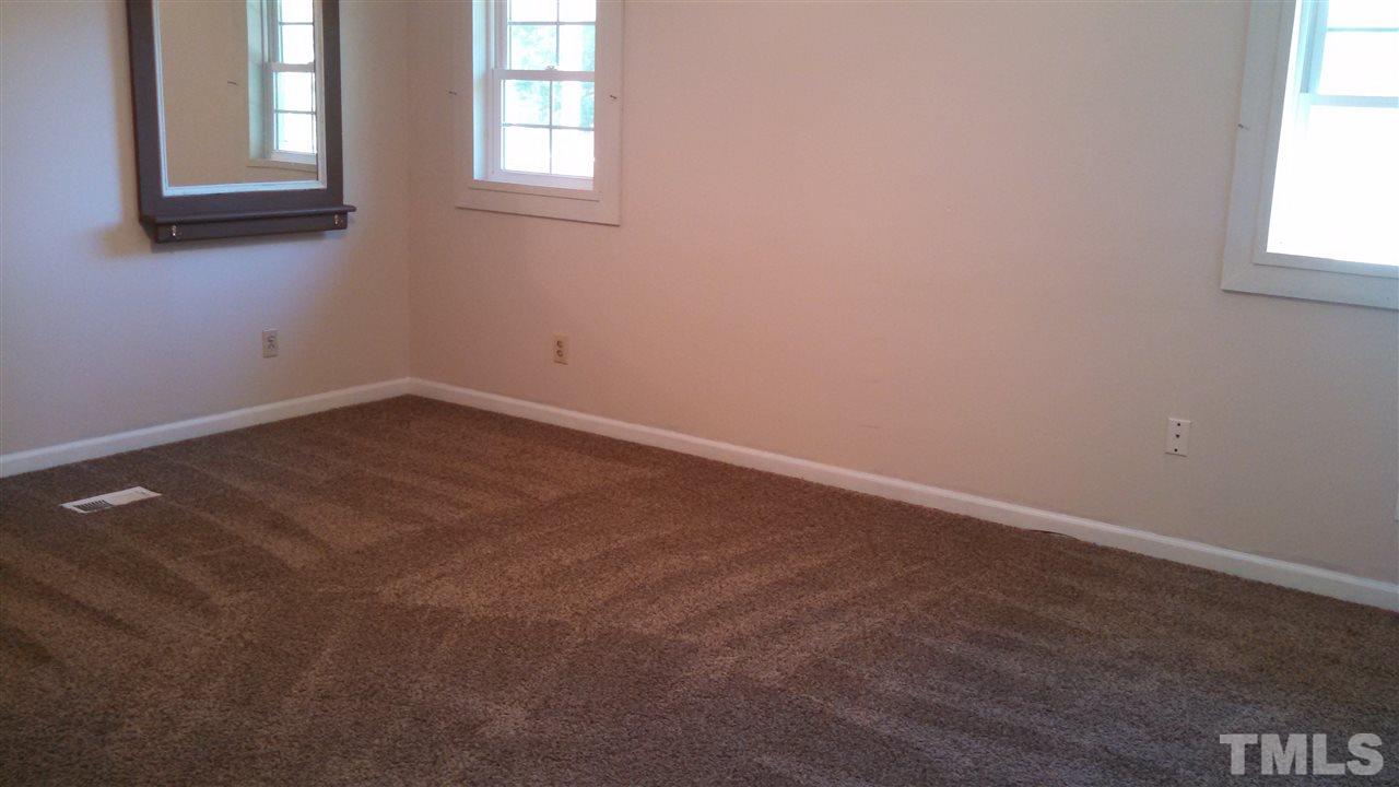 2001 Sanders Road Stem, NC 27581 - Photo 11 of 21 an empty room with a window