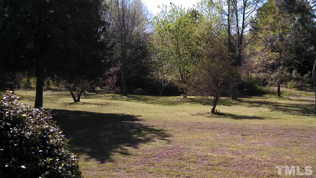 2001 Sanders Road Stem, NC 27581 - Photo 16 of 21 a view of a tree with a yard