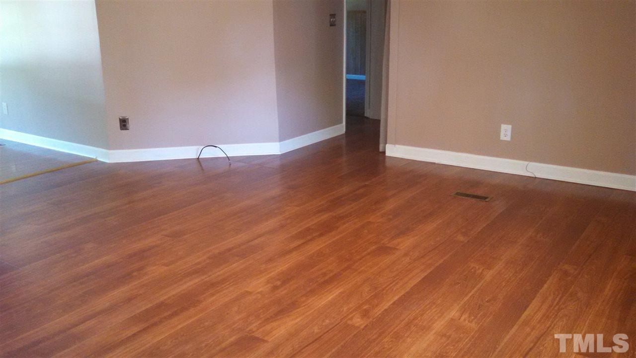 2001 Sanders Road Stem, NC 27581 - Photo 4 of 21 a view of a room with wooden floor