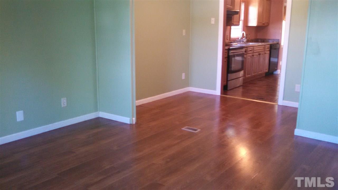 2001 Sanders Road Stem, NC 27581 - Photo 7 of 21 an empty room with wooden floor