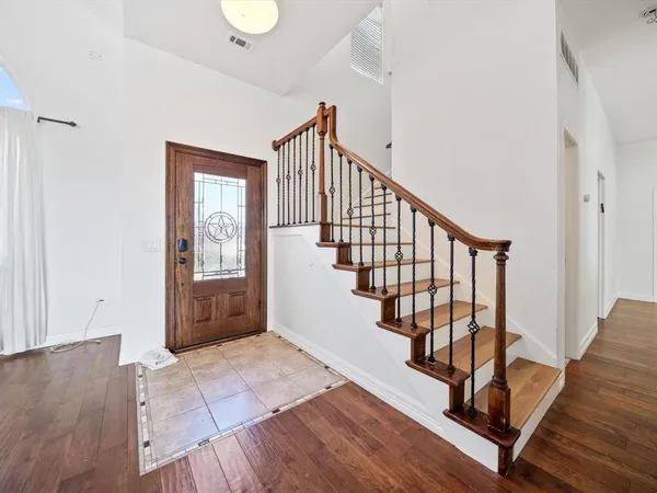 a living room with furniture a couch and a table