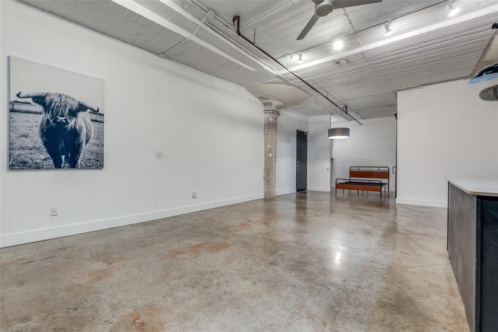 1122 Jackson Street, Unit 922 Dallas, TX 75202 - Photo 10 of 25 a view of a livingroom with furniture and floor to ceiling window