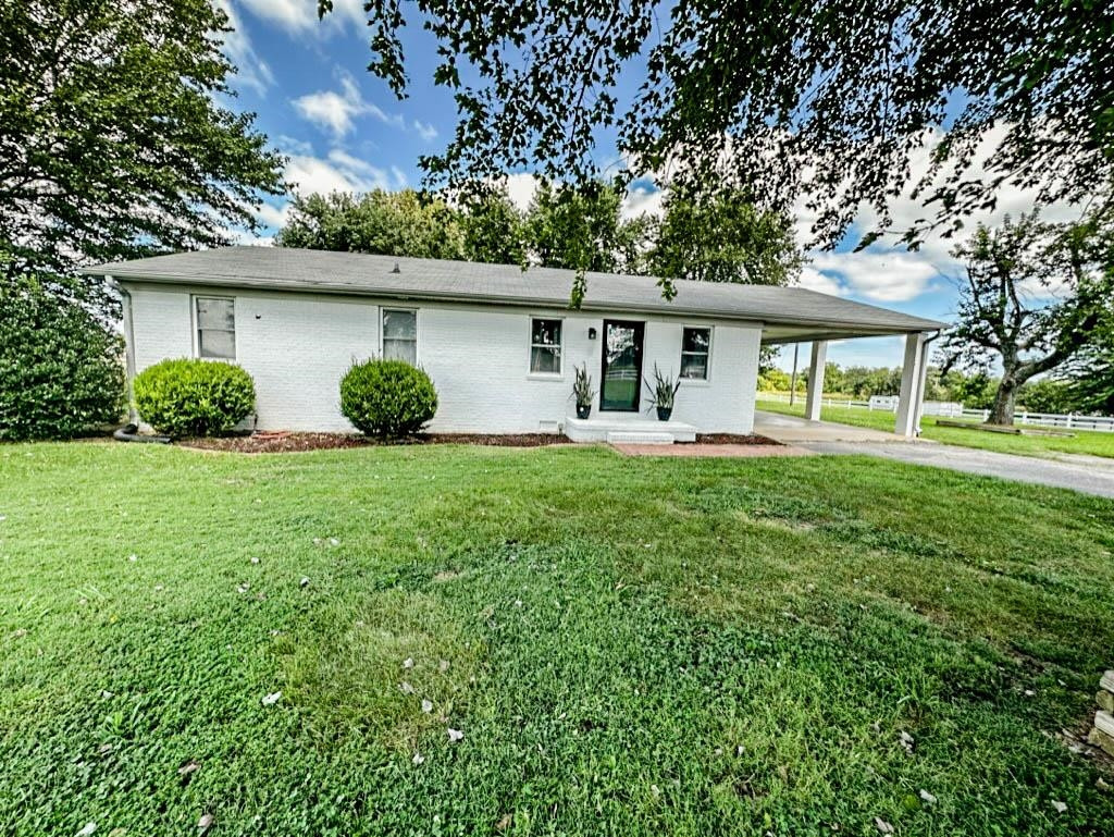 888 Jones Road Bells, TN 38006 - Photo 1 of 21 front view of a house with a yard