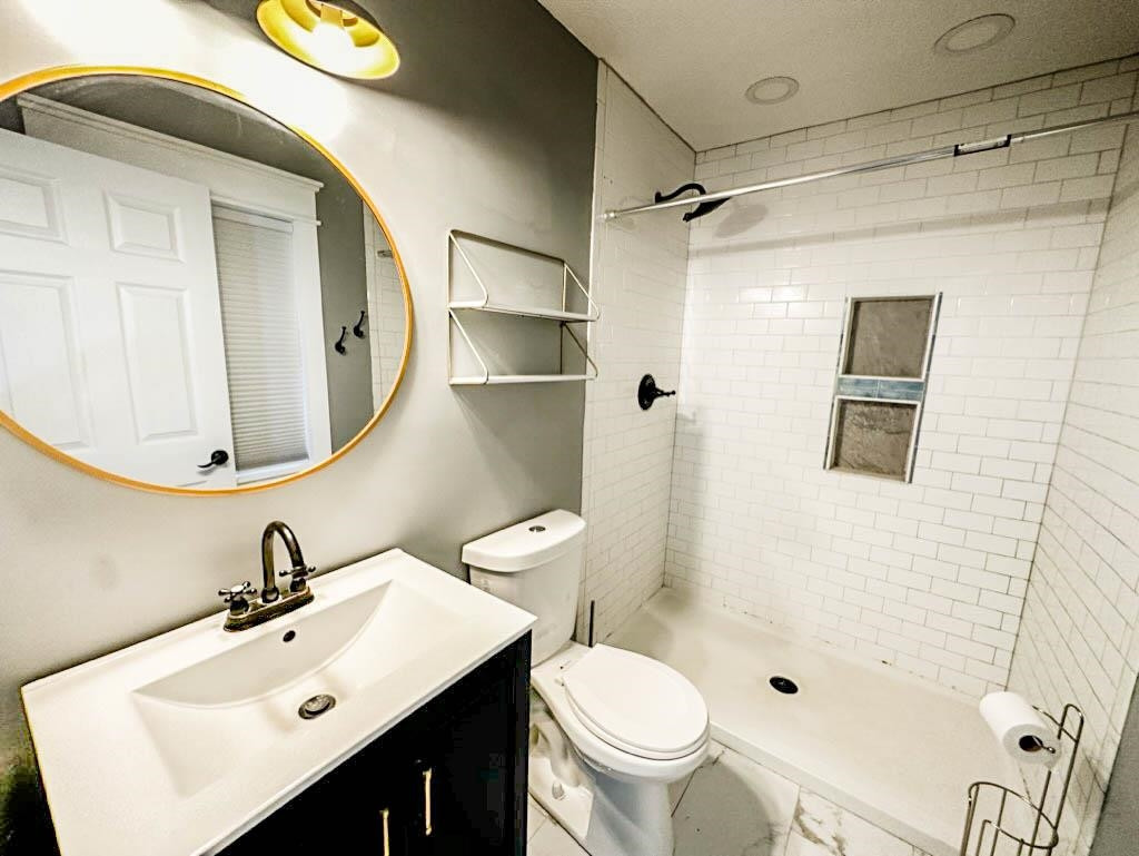 888 Jones Road Bells, TN 38006 - Photo 11 of 21 a bathroom with a sink mirror toilet and shower