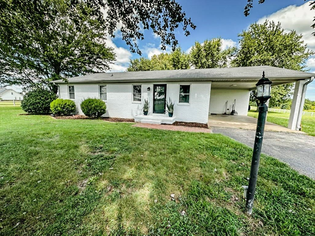 888 Jones Road Bells, TN 38006 - Photo 2 of 21 front view of a house with a yard