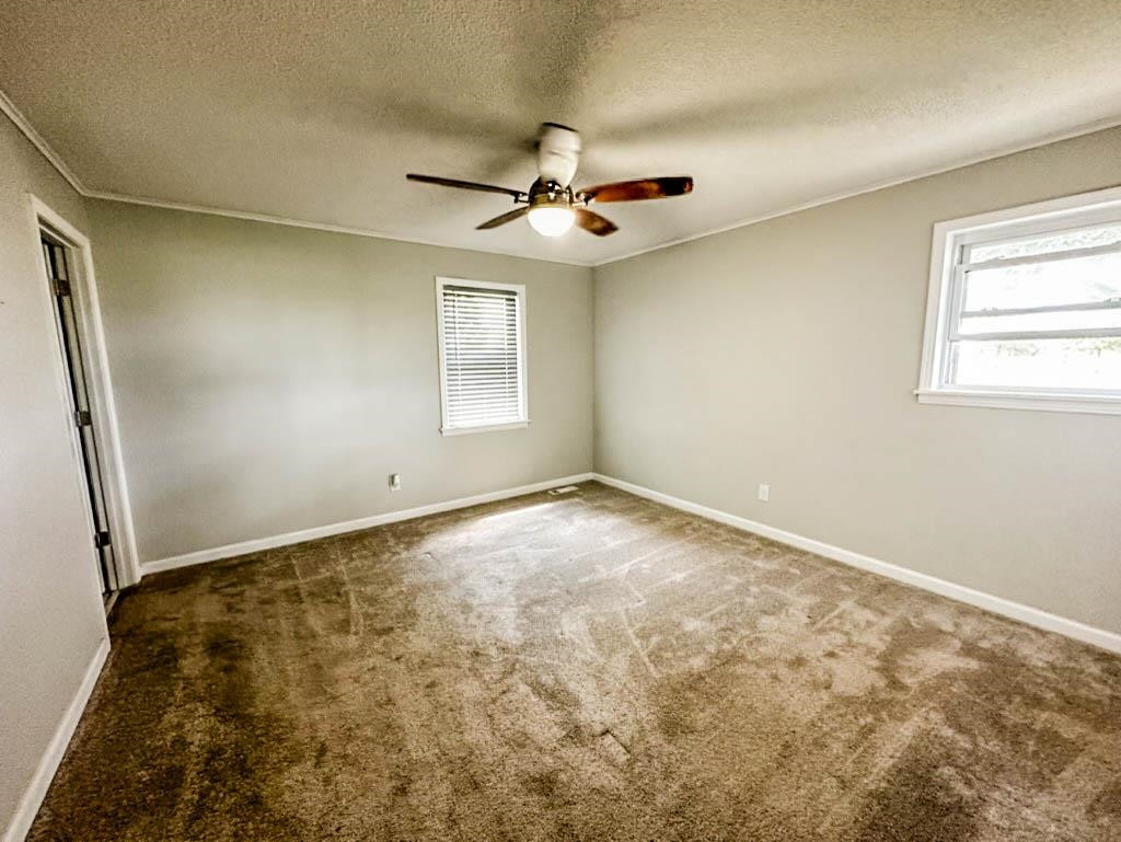 888 Jones Road Bells, TN 38006 - Photo 6 of 21 an empty room with windows and fan