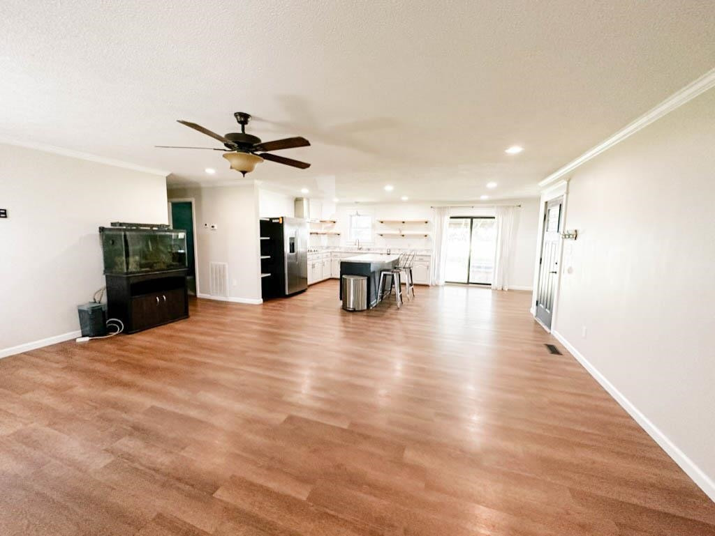 888 Jones Road Bells, TN 38006 - Photo 8 of 21 a view of empty room with wooden floor