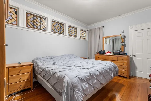 a bedroom with a bed and a cabinets