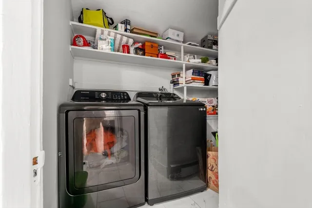 a utility room with dryer and washer