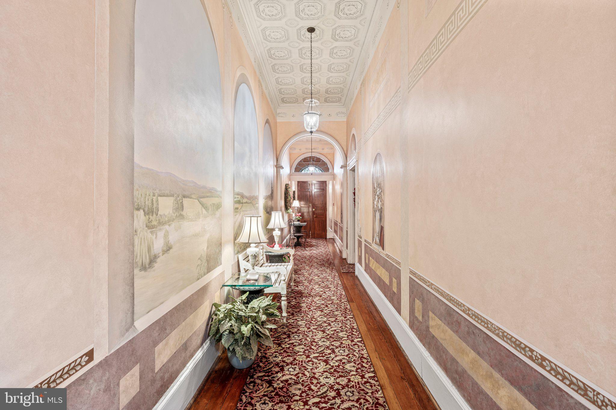 240 South 3rd Street, Unit 2 Philadelphia, PA 19106 - Photo 4 of 8 a view of a hallway with a potted plant