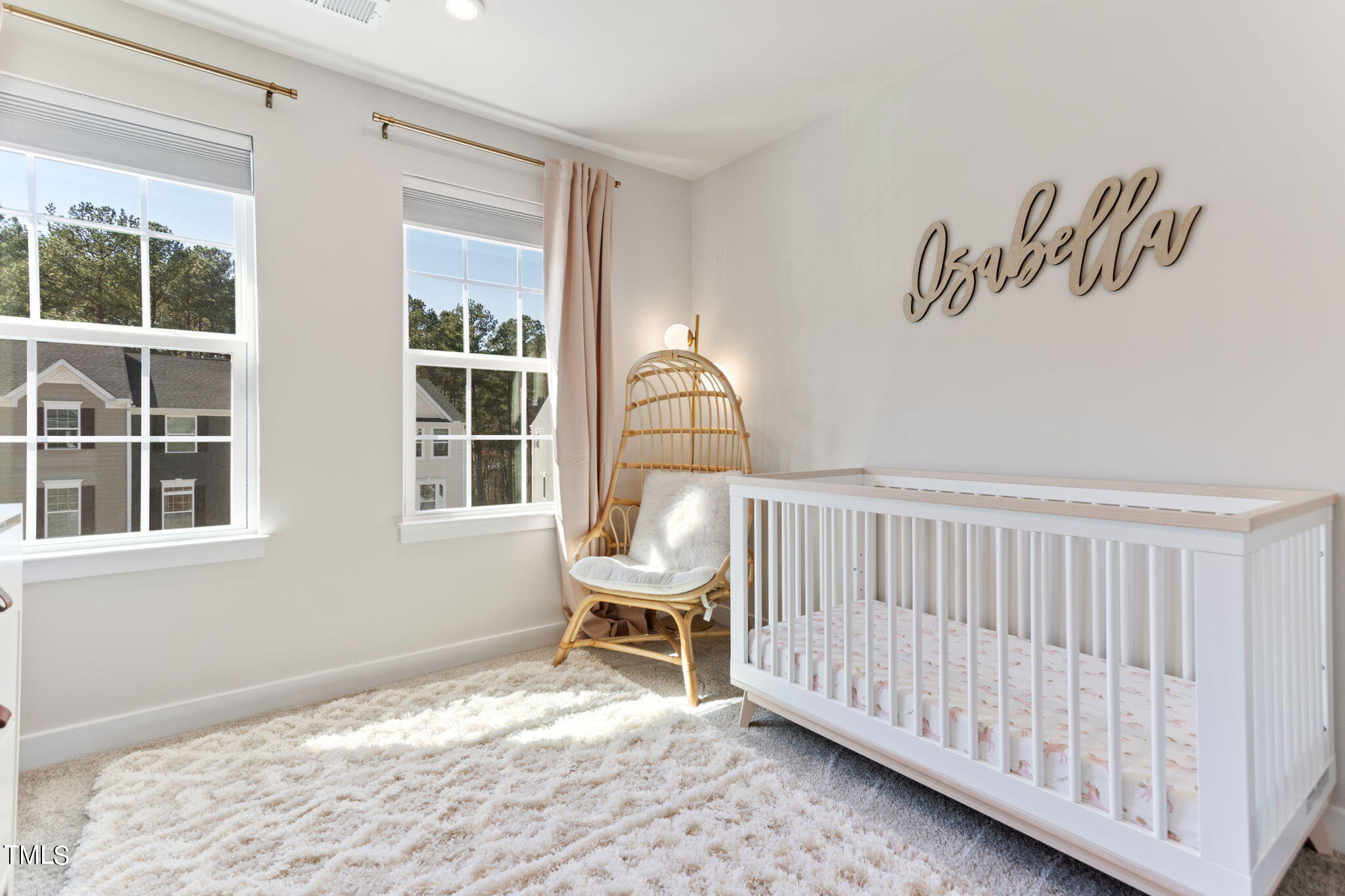 4765 Randall Road Durham, NC 27707 - Photo 13 of 30 a view of a bedroom with wooden floor & a window