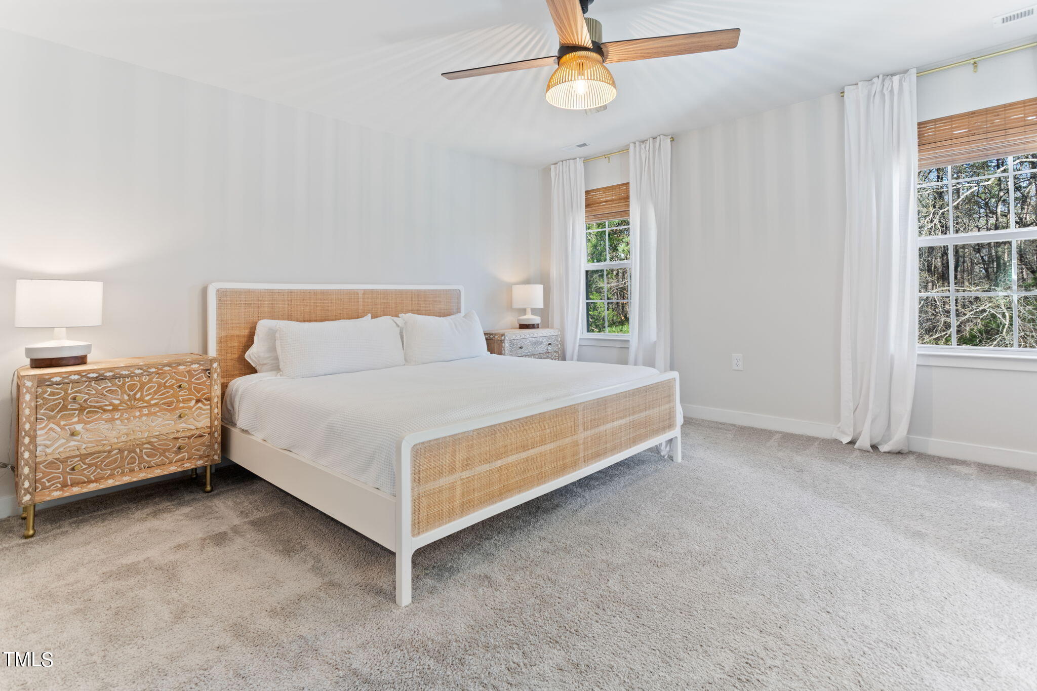 4765 Randall Road Durham, NC 27707 - Photo 15 of 30 a bed sitting in a spacious bedroom next to a window