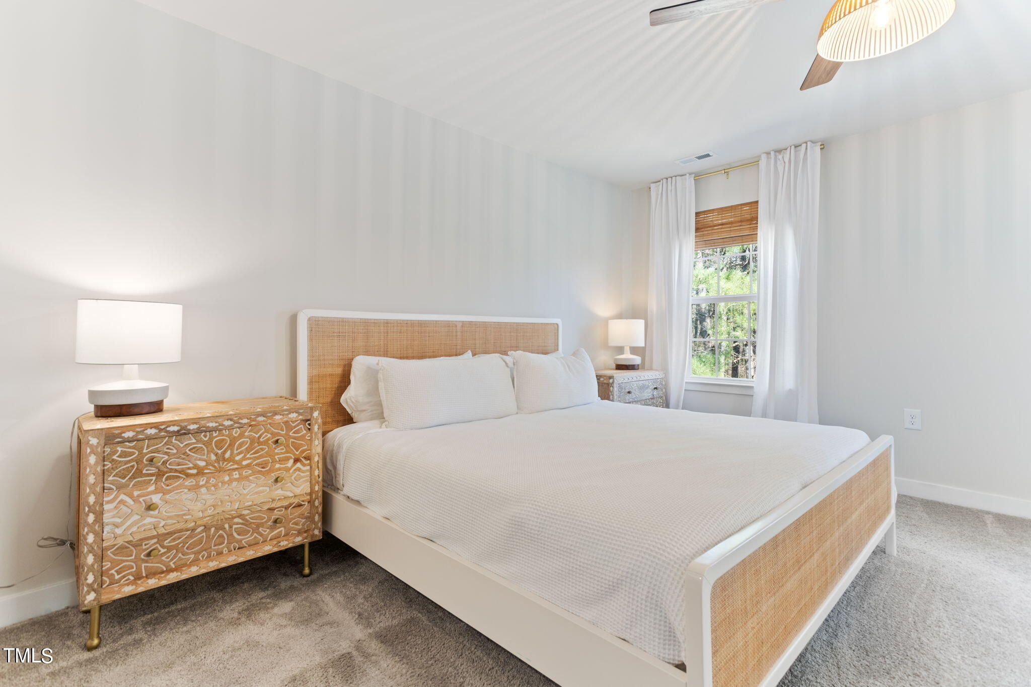 4765 Randall Road Durham, NC 27707 - Photo 16 of 30 a bedroom with a bed and window