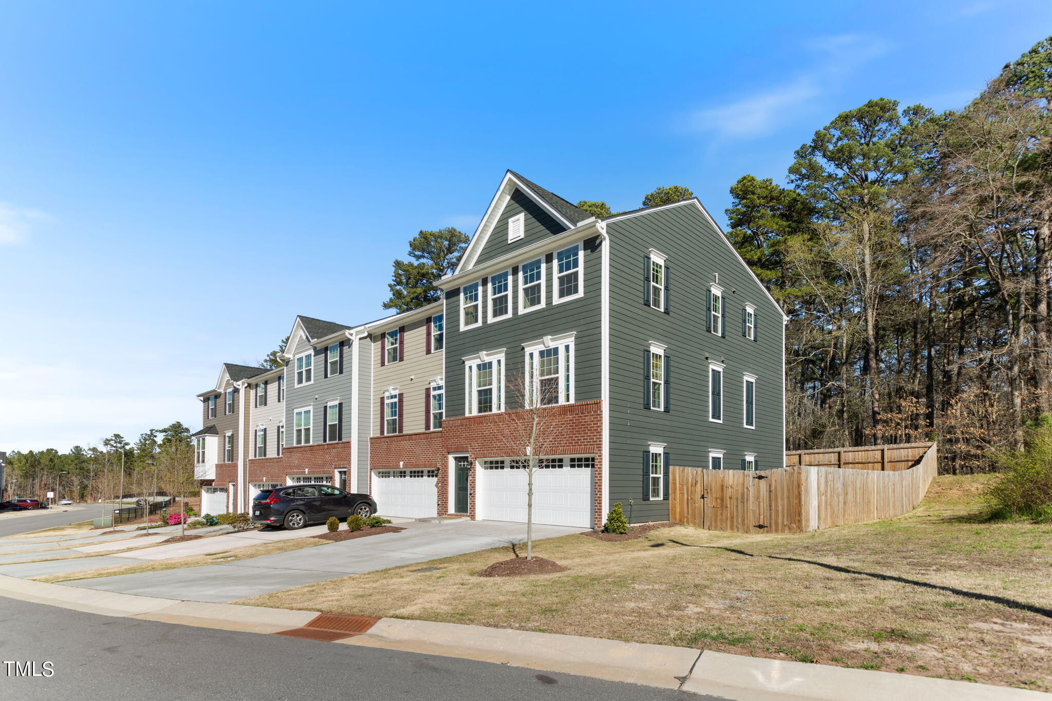 4765 Randall Road Durham, NC 27707 - Photo 2 of 30 a front view of a building with a garden