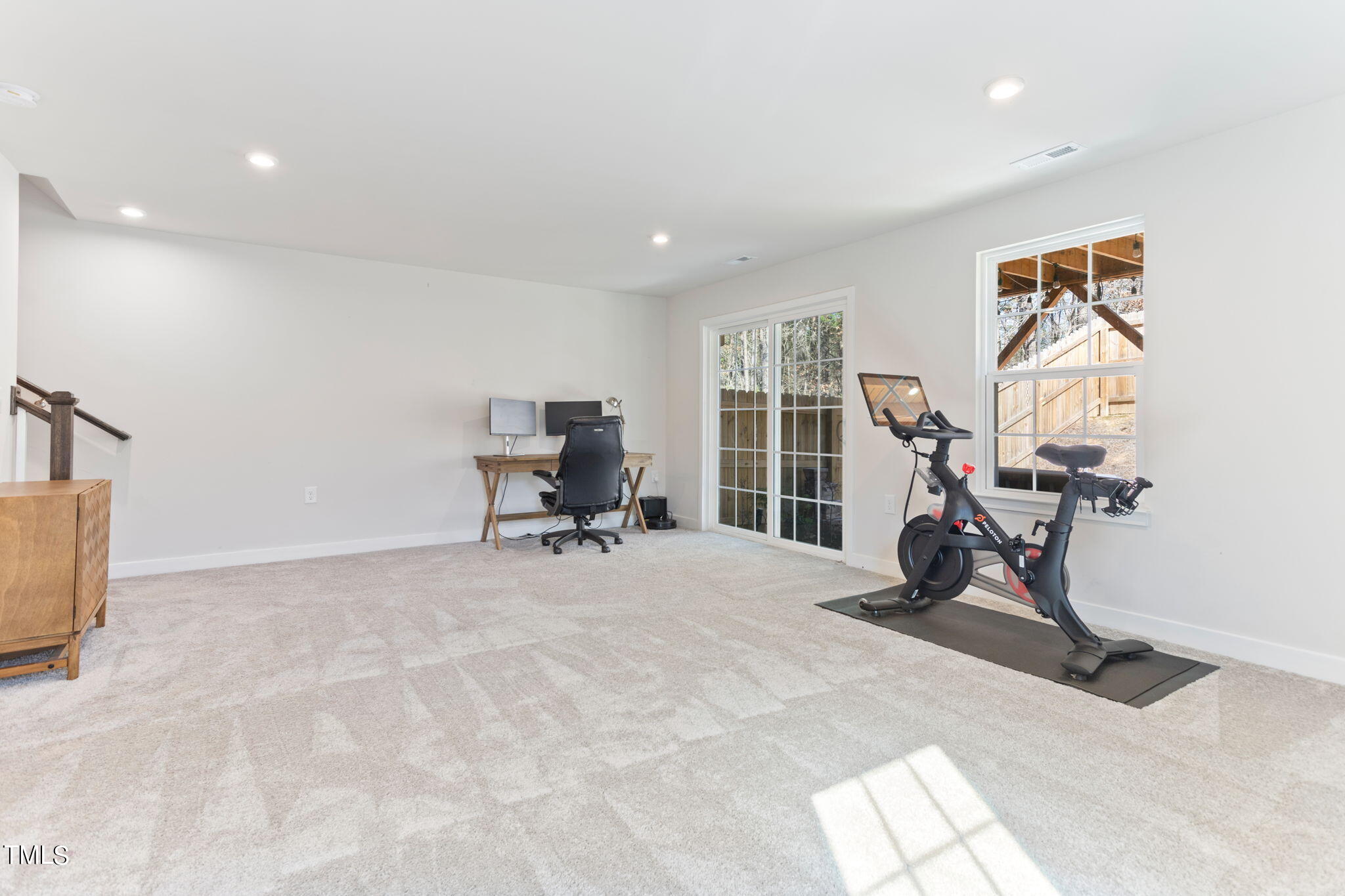 4765 Randall Road Durham, NC 27707 - Photo 21 of 30 a view of a workspace with furniture and a window