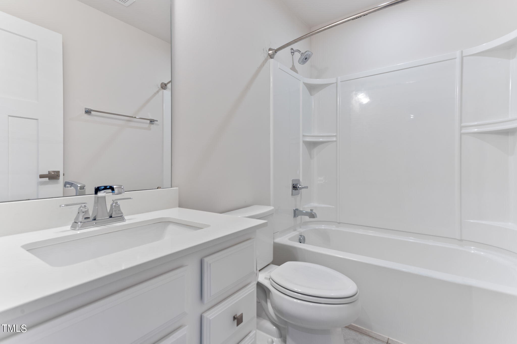 4765 Randall Road Durham, NC 27707 - Photo 25 of 30 a bathroom with a sink toilet vanity and shower
