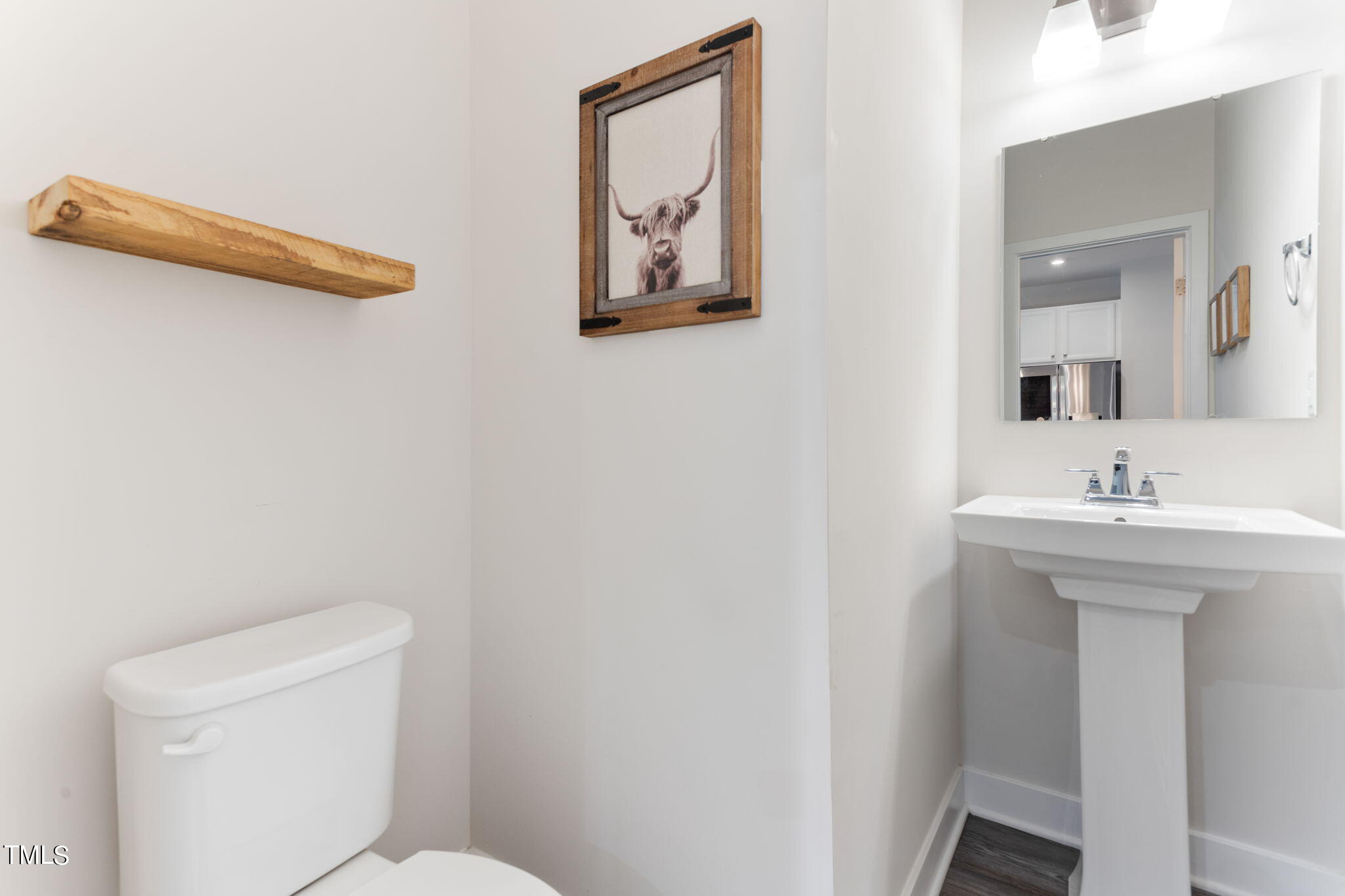 4765 Randall Road Durham, NC 27707 - Photo 27 of 30 a bathroom with a toilet and a sink