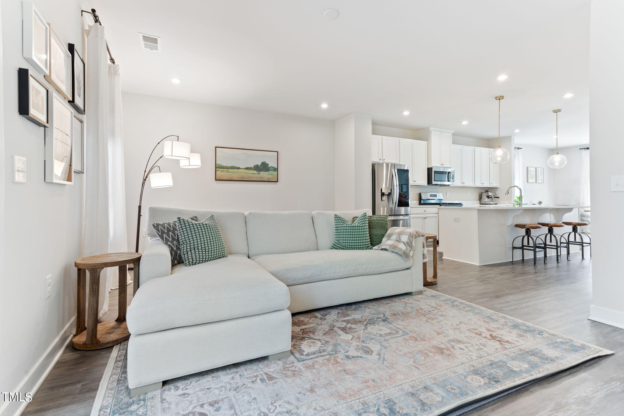 4765 Randall Road Durham, NC 27707 - Photo 4 of 30 a living room with furniture and kitchen view