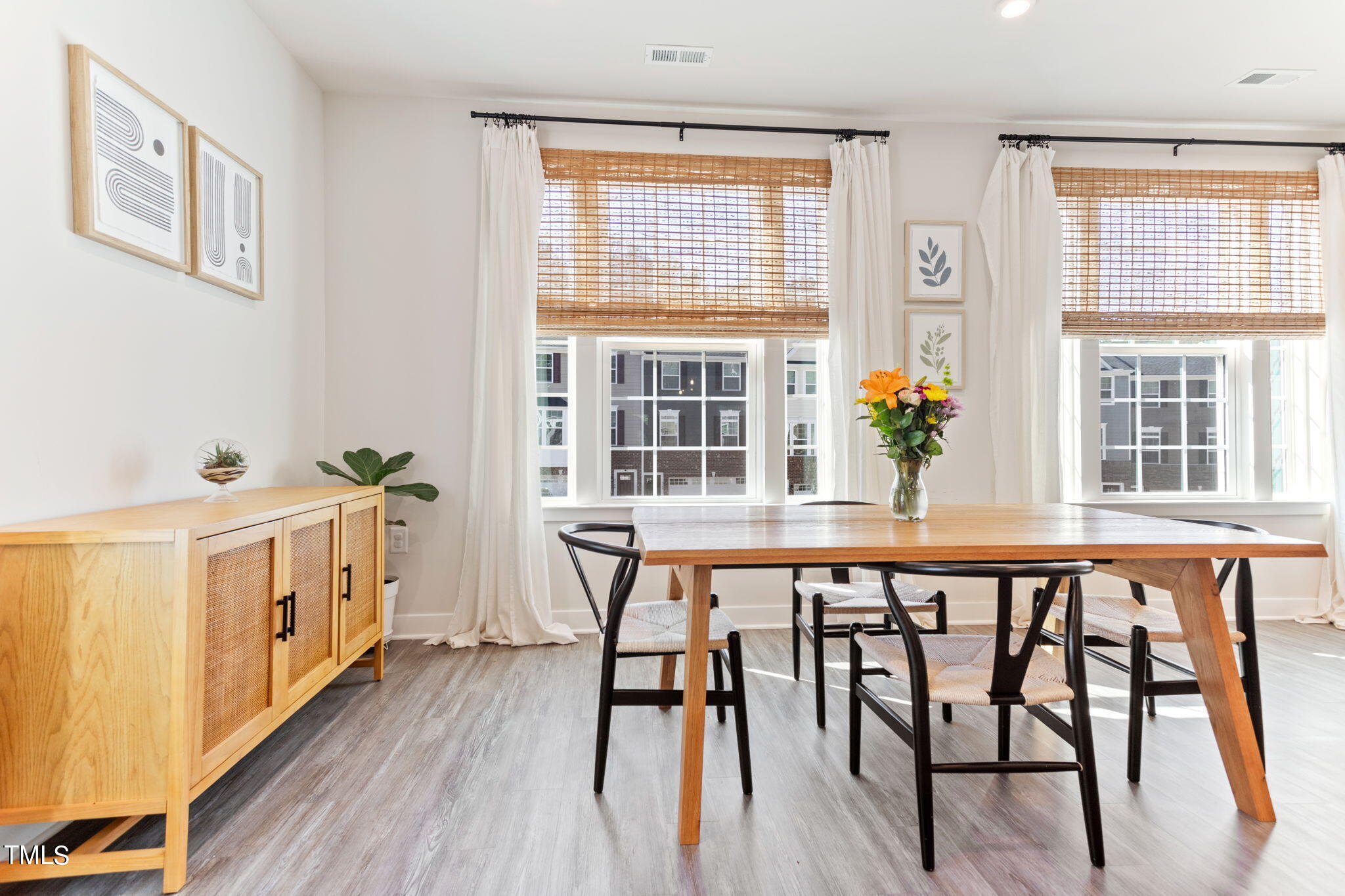 4765 Randall Road Durham, NC 27707 - Photo 6 of 30 a view of a dining room with furniture window and wooden floor