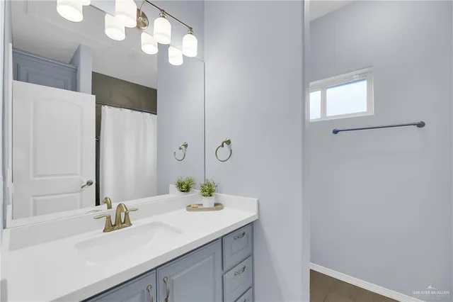 a bathroom with a sink and a mirror