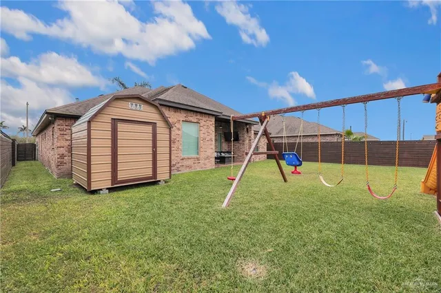 a view of a backyard with a trampoline