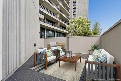 a view of balcony with furniture