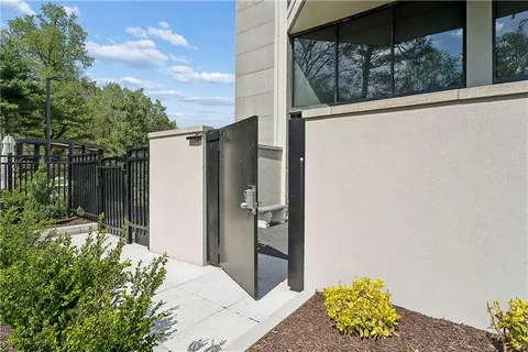 a balcony with table and chairs