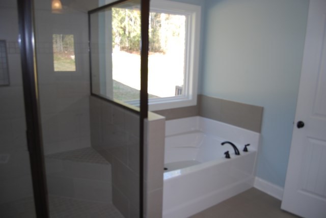 10 Laurel Ridge Forsyth, GA 31029 - Photo 14 of 23 a bathroom with a bathtub